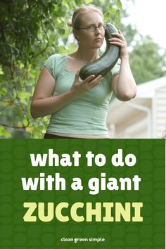 a woman talking on a cell phone while holding a giant snake in her hand with the caption what to do with a giant zucchini