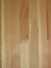 closeup of wood grains on the side of a wooden flooring paneled wall