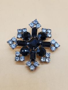 In good vintage condition.  Clearly stamped.  Silver tone metal with clear and black rhinestones. Please look at the pictures for details and condition because the exact item pictured is the exact item that you will receive. Antique Black Brooch For Evening, Antique Black Evening Brooch, Antique Black Brooches For Evening, Vintage Black Party Pins, Black Rhinestones Brooch For Gift, Black Rhinestone, Rhinestone Brooches, Clear Rhinestones, Costume Jewelry