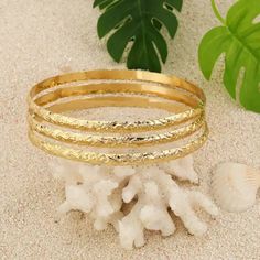 This Trio Bangle Bracelet Features A Beautiful Traditional Hawaiian Flower And Scroll Design. Each Bracelet Is Approximately 5.5-6mm Wide. Available In A Variety Of Sizes. Makes A Beautiful Gift For Mom, Sister, Daughter, Niece Or A Lovely Gift For Yourself Elegant Stackable Beach Jewelry, Gold Stackable Beach Jewelry, Gold Stackable Jewelry For Beach, Gold Stackable Jewelry For The Beach, Elegant Yellow Gold Beach Bracelets, Hawaiian Bracelets, Hawaiian Flower, Floral Bracelet, Hawaiian Flowers