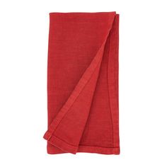 the red linen napkin is folded up on a white background