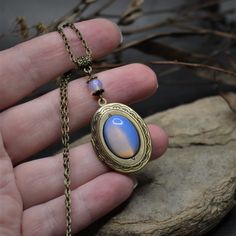 Opalite locket necklace. Moonstone medallion. Bronze locket in vintage style. Witchy jewelry gift for her. Witchcraft pendant necklace. Inaksh jewelry. Mother's day gift. In addition to photographs, a lock of a loved one's hair, images of the faces of saints, a prayer, a heartfelt message, a talisman, solid perfume, etc. were often kept in medallions. This feature of the jewelry makes it very personal for the wearer, illing the pendant with a mysterious meaning.Each product is packed in a reusab Bohemian Brass Locket Necklace, Handmade Antique Jewelry Gift, Bronze Bohemian Locket Necklace, Antique Gold Bohemian Locket Necklace, Vintage Round Pendant Jewelry As A Gift, Vintage Round Pendant Jewelry As Gift, Vintage Round Pendant Jewelry For Gift, Vintage Antique Gold Necklace Gift, Vintage Round Pendant Jewelry Gift