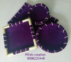 three purple plates with white stripes on them