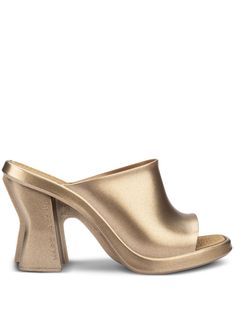 gold-tone metallic finish square open toe branded insole slip-on style high block heel Modern Gold Sandals With Branded Heel Counter, Modern Gold Sandals With Branded Heel, Modern Gold Heels With Sculpted Heel, Gold Mules With Padded Block Heel, Luxury Gold Mules With Block Heel, Luxury Gold Mules With Padded Heel, Elegant Gold Slides For Spring, Gold Block Heels With Sculpted Heel, Gold Heels With Sculpted Block Heel