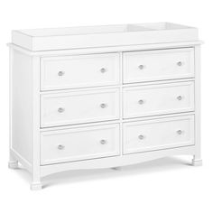 a white dresser with six drawers and two baby cribs in the bottom drawer