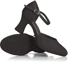 a pair of women's black shoes with straps and heels on each side, one heel