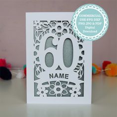 a close up of a card with the number 60 on it's front and side