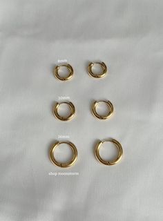 These essential huggies are so stunning on and match everything. An absolute essential in every jewelry collection. Model is wearing size 16mm hoops! - Stainless steel - Water resistant - Will not rust or tarnish - Select desired size (8mm, 10mm, 16mm) - Photos are shown from smallest to largest hoops (top to bottom) Mens Silver Hoop Earrings, Heart Cross Necklace, Gold Huggie Hoop Earrings, Gift Ideas Birthday, Gold Heart Earring, Unisex Earrings, Bold Earrings, Jewelry Essentials, Free Earrings