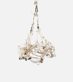 a white chandelier hanging from a ceiling