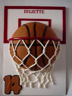 a basketball hanging on the wall in front of a plaque that reads,'24