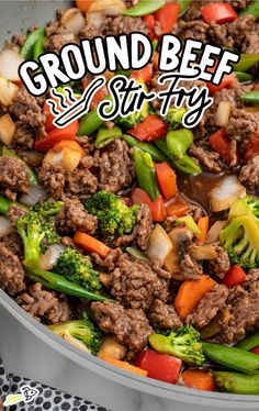 ground beef and stir fry with vegetables in a pan