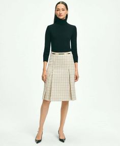 We took classically beautiful tattersall and wove the pattern into sumptuous lambswool for a statement skirt that looks effortlessly chic. An of-the-moment A-line shape, box pleats and leather horse-bit waist detail finish the piece with a nod to heritage American style..26' center back length.100% Lambswool.Dry Clean.Imported.We took classically beautiful tattersall and wove the pattern into sumptuous lambswool for a statement skirt that looks effortlessly chic. An of-the-moment A-line shape, b Pleated Chiffon Blouse, Brooks Brothers Women, Statement Skirt, Wishlist 2024, Skirt Suits, Aline Skirt, Merino Wool Cardigan, Opaque Tights, Cashmere Turtleneck