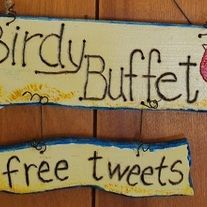 two wooden signs that say birdy buffet and free tweets