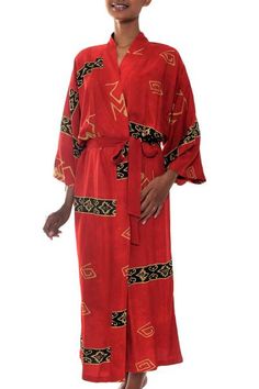 Bold bands of black and beige make a captivating combination with crimson. Revealing traditional motifs they show the tonal variations of batik. Nyoman Nadri fashions this dramatic robe from featuring a front-wrap style wide sleeves and matching belt. This handpainted batik robe is a truly original work of art. Sunlight water dye and temperature all factor into the look of the finished robe. This should be considered a unique design made especially for you. Colors and pattern placement will vary Dramatic Robe, Women Robe, Robe Women, Sunset Red, Traditional Kimono, Batik Pattern, Black And Beige, Women Artisans, Artisan Craft