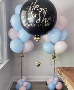 balloons and streamers with the words he or she pop to see