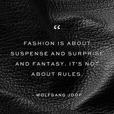 a black leather texture with the quote fashion is about suspense and surprise and fantasy, it's not about rules