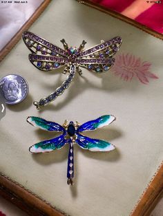 1. Elevate your outfit with these stunning vintage dragonfly brooches adorned with shimmering crystals. Perfect for adding a touch of elegance and whimsy to any ensemble, these brooches are a must-have accessory for any fashion-forward individual. Made with high-quality materials, these dragonfly brooches are sure to become a cherished addition to your jewelry collection. Elegant Adjustable Dragonfly Jewelry, Luxury Elegant Dragonfly Jewelry, Dragonfly Brooch Jewelry As A Gift, Dragonfly Brooch Jewelry For Gift, Elegant Dragonfly Brooch As Gift, Elegant Dragonfly Brooch For Gift, Dragonfly Brooch Jewelry Gift, Vintage Handmade Dragonfly Necklace, Wedding Brooches