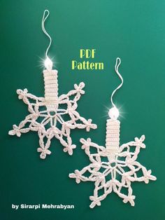 two crocheted snowflakes are hanging from strings on a green background with the words free pattern