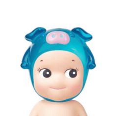 a baby doll with a blue hat on it's head and eyes, sitting in front of a white background