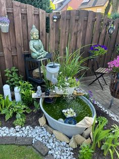 a small garden with a fountain in the middle