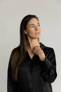 Feel the luxury with our Silk Long Sleeve Pajama Top as it glides over your skin effortlessly. Treated with aloe vera and made from 100% mulberry silk, this top is lightweight, soothing, and loose-fitting. Featuring a chest pocket, elegant mulberry silk flat piping, inner French seams, logo engraved shell buttons, and an eco-friendly plated logo charm. Pair with our women's silk pajama shorts or women's silk pajama pants for the ultimate silk sleep set. DETAILS: 100% mulberry silk Chic Silk Long Sleeve Sleepwear, Chic Long Sleeve Silk Sleepwear, Elegant Long Sleeve Tops For Lounging, Elegant Long Sleeve Sleep Tops, Elegant Long Sleeve Relaxed Fit Sleepwear, Silk Pajama Shorts, Silk Pajamas Shorts, Silk Pajama Pants, Silk Pajamas Women