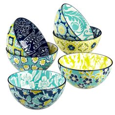 four bowls with different designs on them, one is blue and the other is yellow