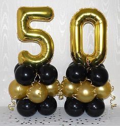 the number 50 balloons are black and gold