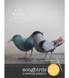 a book with two birds sitting on top of it's cover, and the title songbirds a sewing pattern