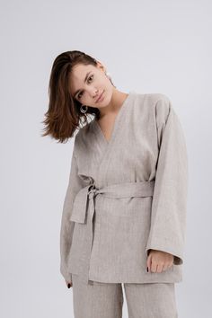 This stunning kimono is perfect for creating a chic and sophisticated look. The comfortable jacket is crafted from natural linen, ensuring breathability and durability. Our cardigan is designed to flatter every body shape and size, making you feel confident and stylish. Elevate your wardrobe with this timeless and luxurious linen kimono that combines comfort with unmatched elegance. KIMONO: Loose fit Dropped shoulders Long sleeves Belt included Sizes: XS, S, M, L, XL, XXL Custom sizes are availa Elegant Long Sleeve Relaxed Fit Kimono, Beige Linen Kimono For Loungewear, Beige Linen Outerwear For Spring, Beige Linen Spring Outerwear, Spring Beige Linen Outerwear, Elegant Relaxed Fit Linen Outerwear, Beige Linen Robe For Spring, Beige Linen Spring Robe, Beige Linen Cardigan With Relaxed Fit