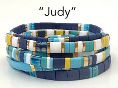 "\"Judy\" - A mix of navy, turquoise, and ocean blue, white, yellow, and gold plated Tila beads. Combination of 5x5, 1/2, and 1/4 size beads. Perfect gifts for women and teens. Each bracelet is $13, save $3 and get FREE SHIPPING on orders of three bracelets!" Tila Jewelry, Trendy Beaded Bracelets, Bracelet Tila, Tila Bead Bracelets, Stretch Beaded Bracelets Diy, Tila Bracelets, Boho Bracelets Stack, Bracelet Trendy, Stack Bracelets