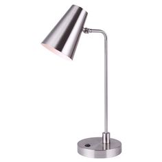 a silver desk lamp on a white background