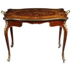 an ornately decorated table with gold trimmings on the top and bottom edge