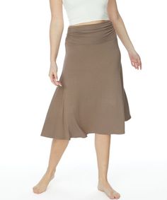 Flared, Mid-length skirtBanded waist with side shirring accentSoft and lightweight240 GSM weightComfortable and flexible fitShe would dance all day with this dazzling skirtMade In: MADE IN USAFabric Contents: ORGANIC BAMBOO SPANDEXCare Instructions: MACHINE WASH Stretch Flared Skirt With Elastic Waistband, Casual Yoga Skirt With 4-way Stretch, Solid Color Flowy Skirt With Banded Waist, Stretch Maxi Skirt With Elastic Waistband, Stretch Skirt With Banded Waist, Stretch Midi Skirt With Gathered Details, Casual Ruched Flared Skirt, Fitted Skirt With Banded Waist, Versatile Gathered Long Skirt