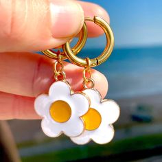 The cutest pair of flower huggie hoops going. Seriousy have you seen daisy charms like these anywhere else?!? 😛 - stainless steel gold huggie hoops - tarnish free - metal & enamel chunky daisy charms - gold plated jump rings  Made by us pickles to make you smile! WORLDWIDE DELIVERY🚚  - UK 3-5 working days - 2nd class FREE - Worldwide - 1-2 weeks - 6.99 Trendy White Huggie Earrings For Everyday, Everyday Trendy White Huggie Earrings, White Flower Hoop Earrings With Flower Charm, Trendy White Huggie Hoop Earrings, Nickel-free White Small Hoop Huggie Earrings, White Nickel-free Small Hoop Huggie Earrings, White Nickel-free Huggie Hoop Earrings, White Hoop Earrings With Flower Charm, Everyday White Flower Charm Earrings