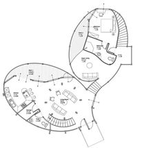 an architectural drawing of a circular house with spiral staircases and living room in the middle