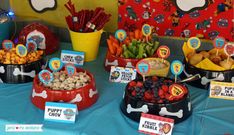 a table topped with lots of different types of foods and desserts next to each other