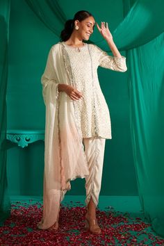 Ivory kurta with all over sequin, thread embroidery. Paired with a draped dhoti pant and peach dupatta. - Aza Fashions Mukaish Work, Tulip Pants, Kurta Patterns, Short Kurta, Dhoti Pants, Satin Color, Thread Embroidery, Embroidered Shorts, Powder Pink