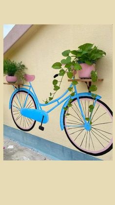 a blue bicycle with plants on the back