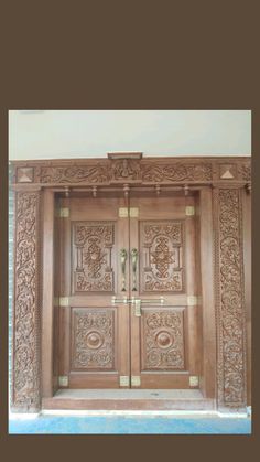 an ornate wooden door with carvings on it