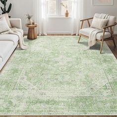 a green area rug in a living room with white furniture and large window behind it