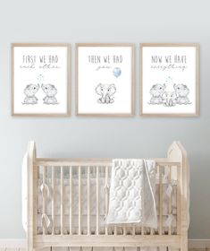 two baby prints are hanging on the wall next to a crib in a nursery