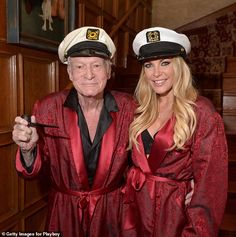 an older man and woman dressed in sailor's hats pose for a photo together