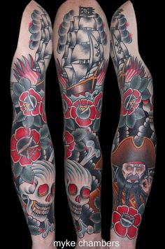 two men with tattoos on their arms and legs, both wearing pirate hats and skulls