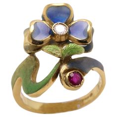 Vintage Hand made in Spain Enamel ring 18K Yellow Gold approx size 0.75' inch (20 mm) has 1 Diamond and 1 Ruby (all natural) Weight approx 4.8 grams Finger size 4.75 (maybe can be resized a little bit -please inquire) Style is based from the period of Nouveau approx made 20+ years ago Overall great condition (a bit aged but looks as new) Brilliant colors too ! (sarah.L #11) Art Nouveau Ring, Edgy Jewelry, Flower Style, Art Nouveau Jewelry, Enamel Ring, Gold Flower, Flower Fashion, Gold Flowers, Fashion Rings