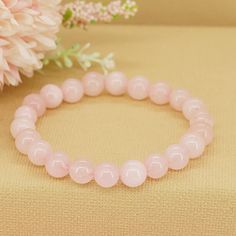 Wrap yourself in the gentle embrace of love and compassion with our Gemstone Rose Quartz Bracelet. Crafted from exquisite rose quartz beads, this bracelet serves as a reminder to open your heart, nurture your relationships, and cultivate inner peace and harmony. * High-Quality Beaded Bracelet* Unisex Bracelet* 8mm beads* Made to Fit Your Wrist or Anklet* Made with Pure Positive Energy* Great Gift for Everyone Elegant Rose Quartz Crystal Bracelet For Meditation, Pink Rose Quartz Bracelets For Meditation, Pink Rose Quartz Bracelet For Meditation, Rose Quartz Round Bracelets For Meditation, Rose Quartz Gemstone Beads Bracelet For Meditation, Pink Beaded Bracelets For Meditation, Rose Quartz Beaded Bracelet For Meditation, Rose Quartz Round Beads Bracelet For Valentine's Day, Pink Gemstone Beads Bracelets For Meditation