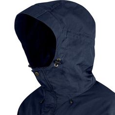 an image of a man wearing a blue raincoat with hood up and buttons on the side