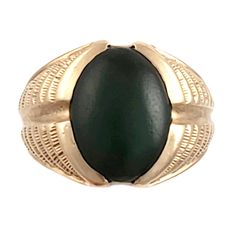 "This striking 14K gold ring features a large green jade stone and an engraved band that resembles a stylized fern or feather. Just the right combination of style and masculinity! Note that the inside of this ring has a lovers inscription and date 1974. Style: Classic, Masculine Vintage: 1970s Materials: 14K Gold, Green Jade Size: 10 Green Jade: 16mm x 12mm Width North to South: approx. 3/4\" Weight: 7.5 dwt / 11.6 g Condition: Very Good ASK ABOUT OUR FREE LAYAWAY! FREE FULLY INSURED PRIORITY SH Mens Jade And Gold Ring, Jade Oval Cabochon Rings With Polished Finish, Oval Cabochon Jade Rings With Polished Finish, Classic Green Jade Rings, Gold Jade Ring With Polished Finish, Resize Ring, Masculine Style, Men Diamond Ring, Jade Ring