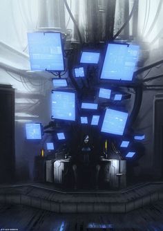 a bunch of blue television screens sitting on top of a table