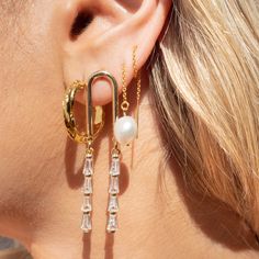 Our Fallon Drop Earrings are your next favorite earrings, seriously! What do we love about them? These gorgeous arched earrings are a show stopper - perfect for a wedding, a night on the town or just to match your boss girl vibes!EARRINGS FEATURE 14k Gold Plated Cubic Zirconia Charms 16k Gold Plated Arched Post Earrings Measure 2" in Length Cora Pearl, Boss Girl, Minimalist Chic, Party Girl, Chain Extenders, How To Apply Makeup, Polish Jewelry, Gold Filled Jewelry, Cleaning Jewelry