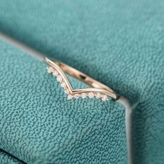 a close up of a diamond ring on a blanket